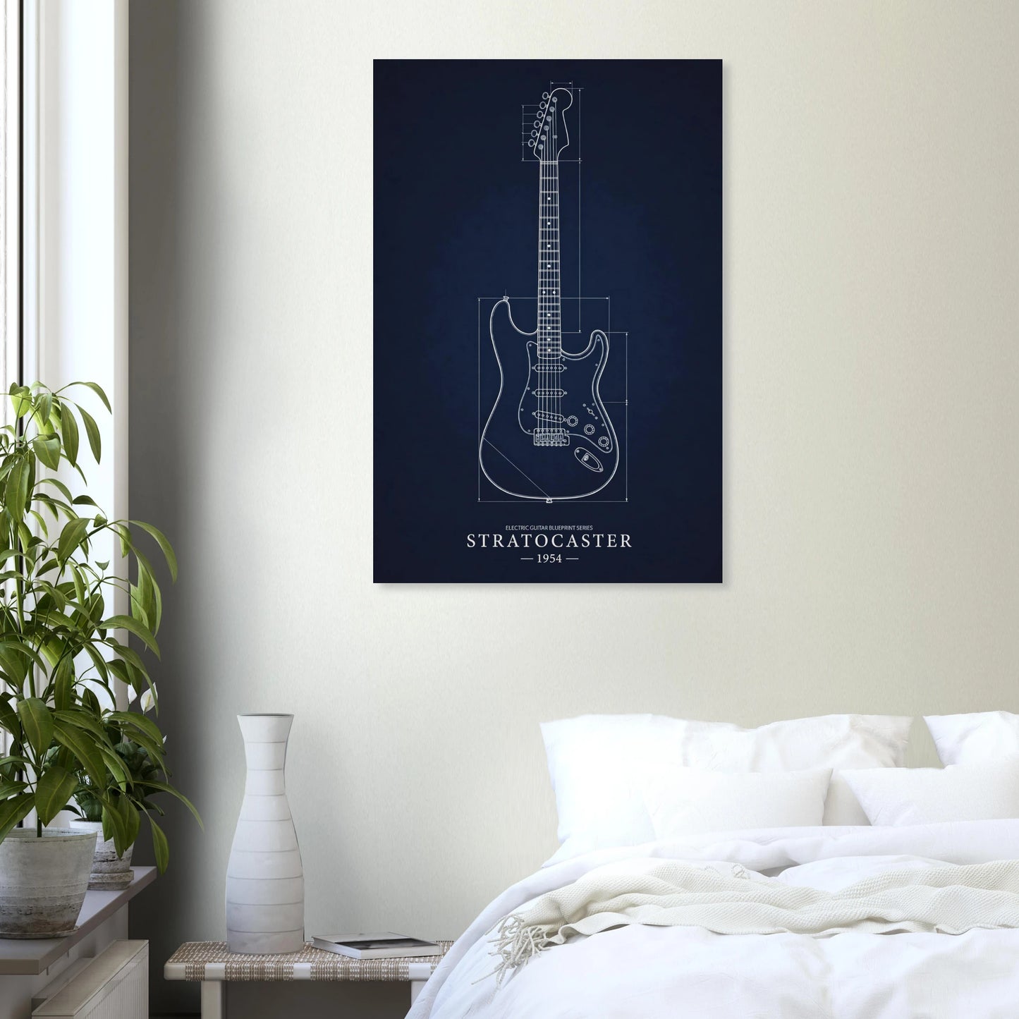 Fender Stratocaster Blueprint art print in a black frame above a bed in a modern bedroom — Guitar Prints museum-quality matte art print