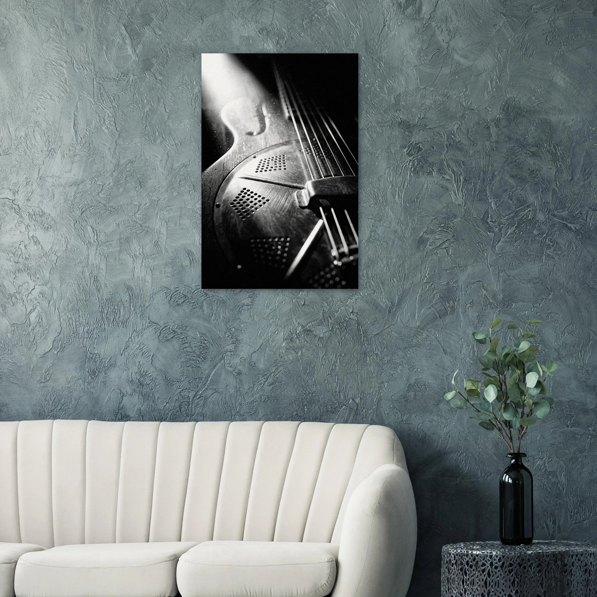 Resonator guitar art print on a teal wall above a modern white sofa — Guitar Prints museum-quality matte art print