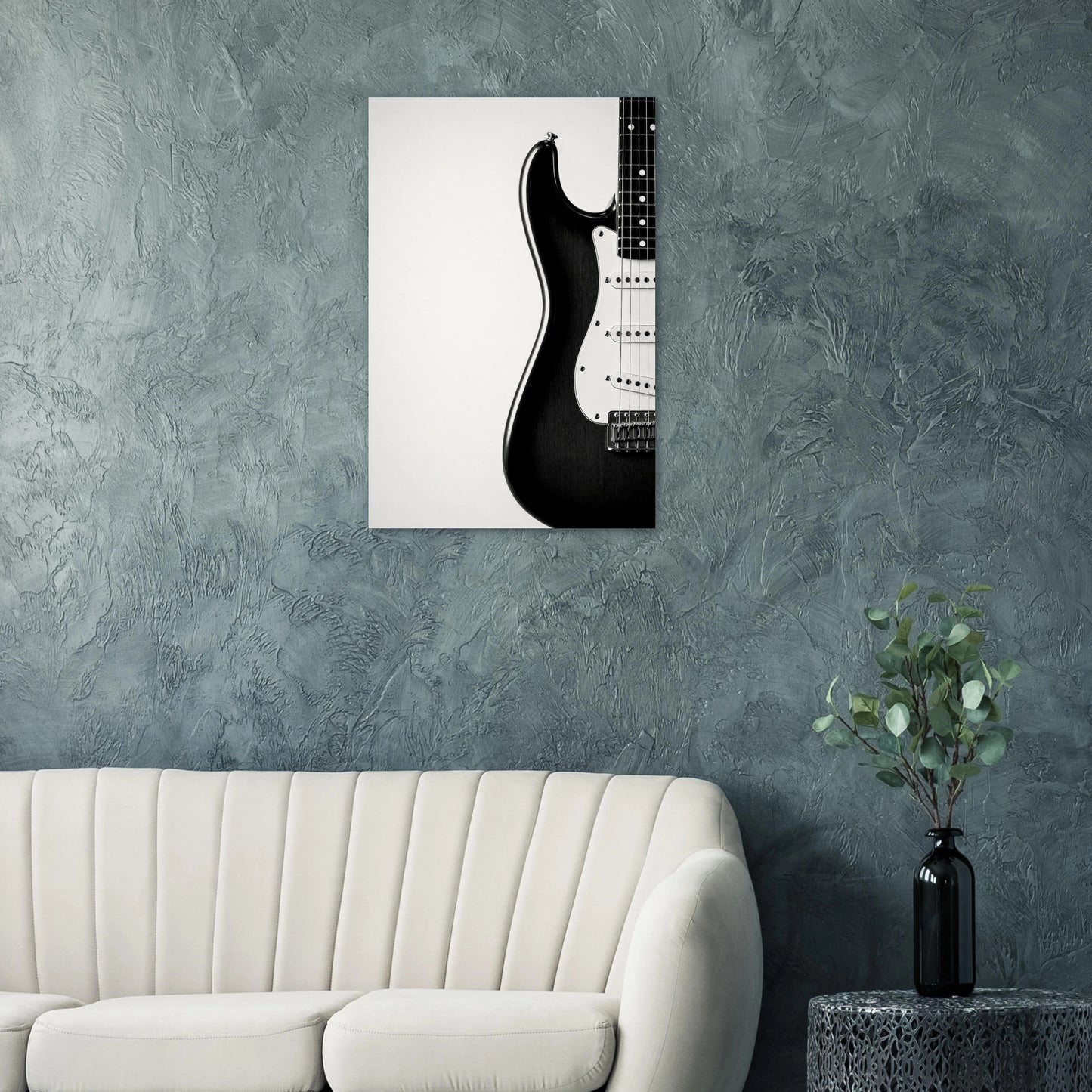 Monochrome Strat art print on a teal wall above a modern white sofa — Guitar Prints museum-quality matte art print