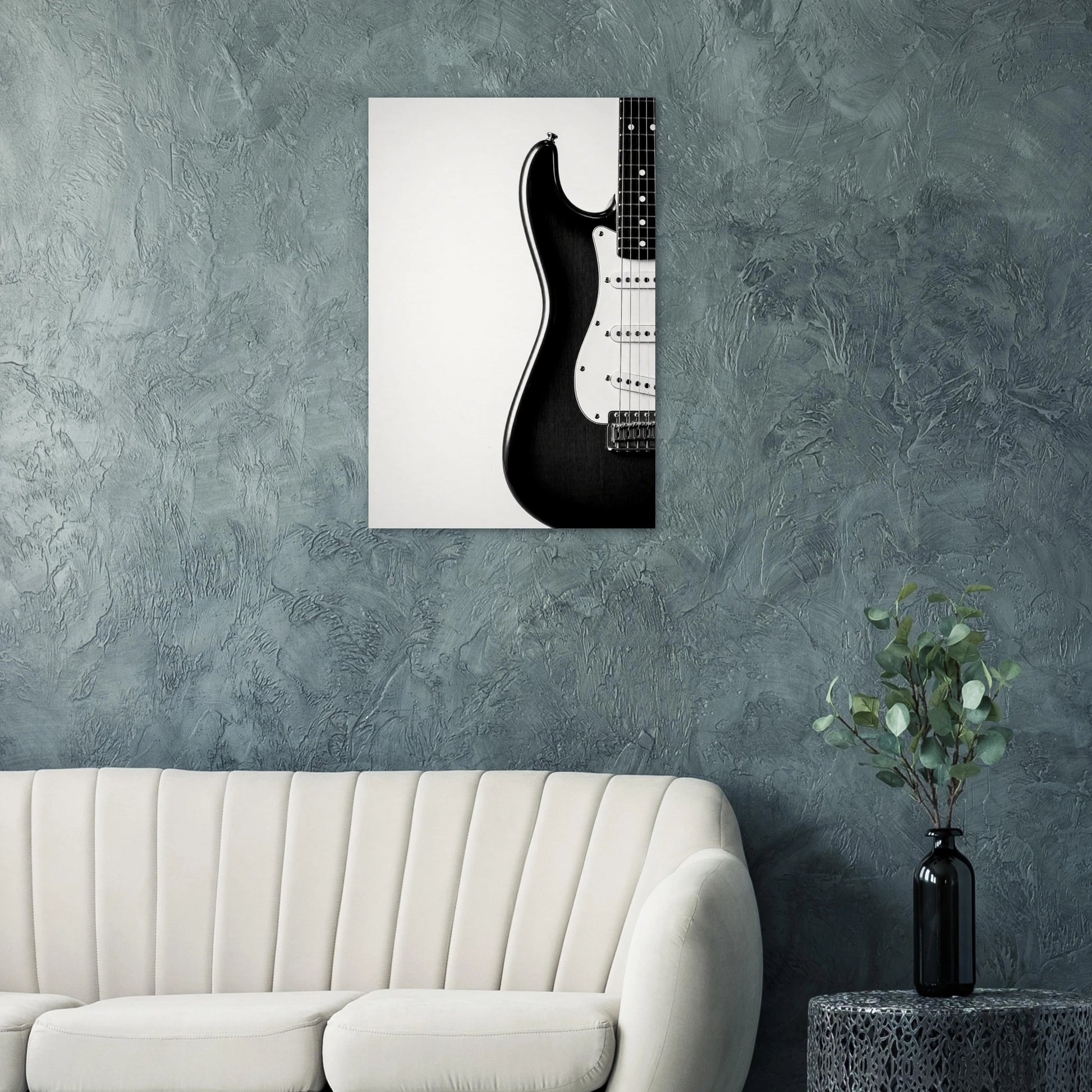 Monochrome Strat art print on a teal wall above a modern white sofa — Guitar Prints museum-quality matte art print