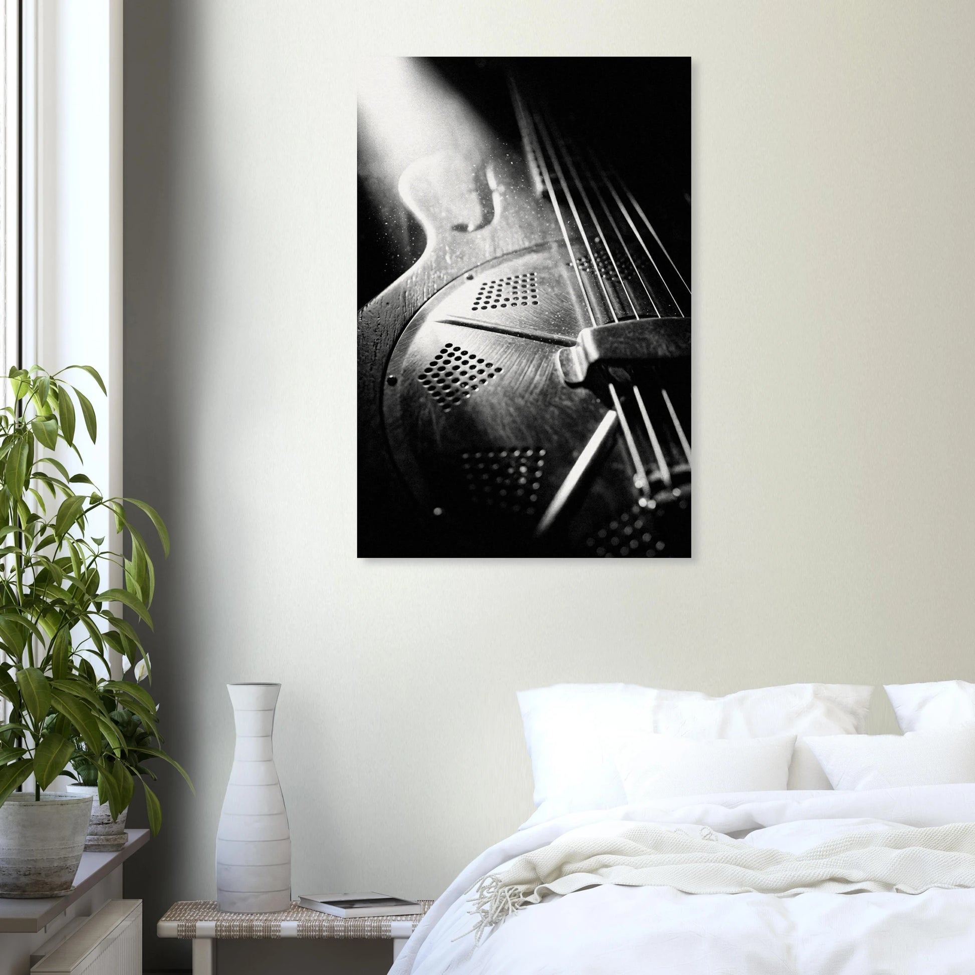 Resonator guitar art print in a black frame above a bed in a modern bedroom — Guitar Prints museum-quality matte art print