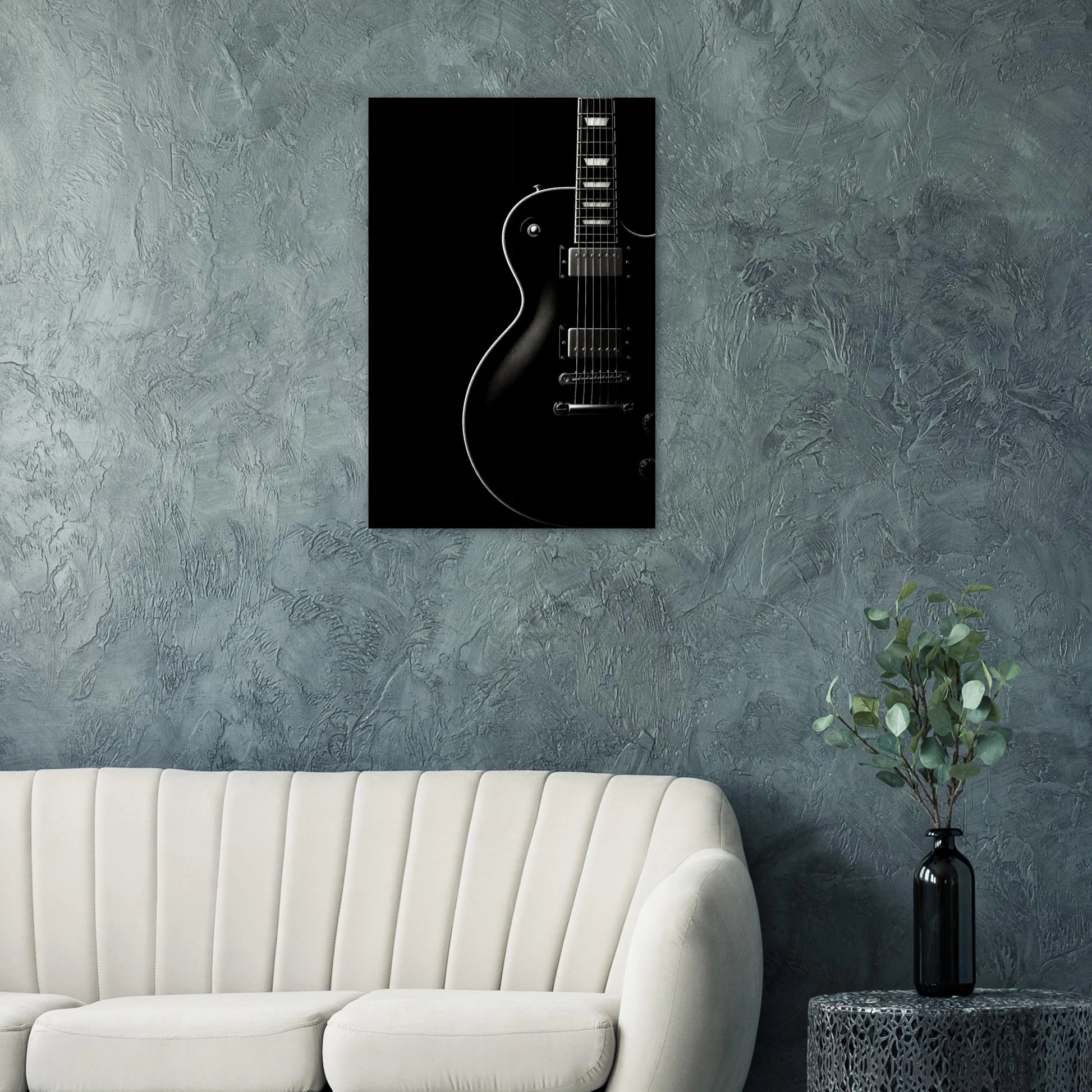 Black Resonance black and white electric guitar wall art print displayed in a modern minimalist living room with dark tones and cinematic lighting.