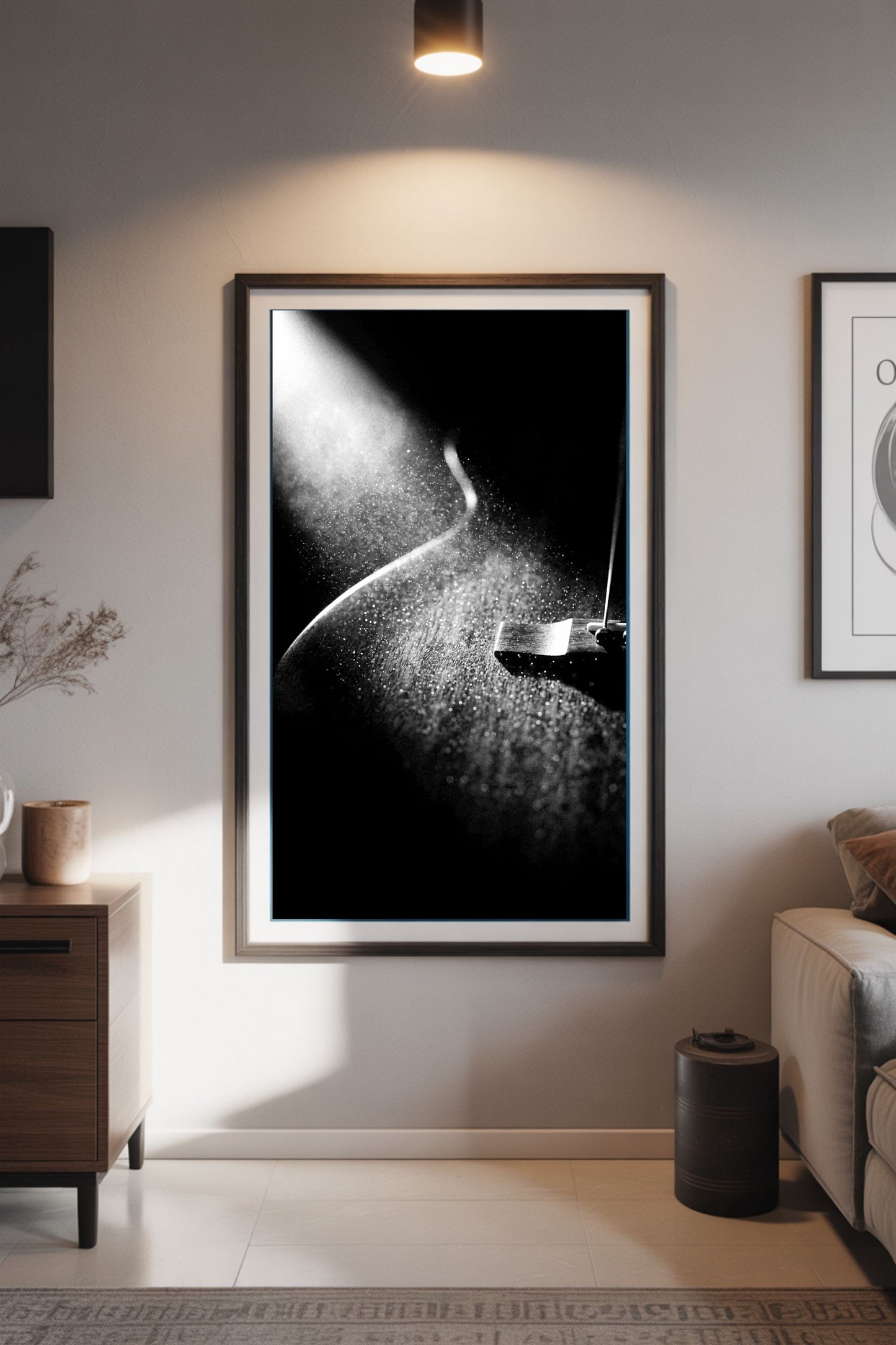 Framed black and white guitar artwork on a wall in a living room setting.