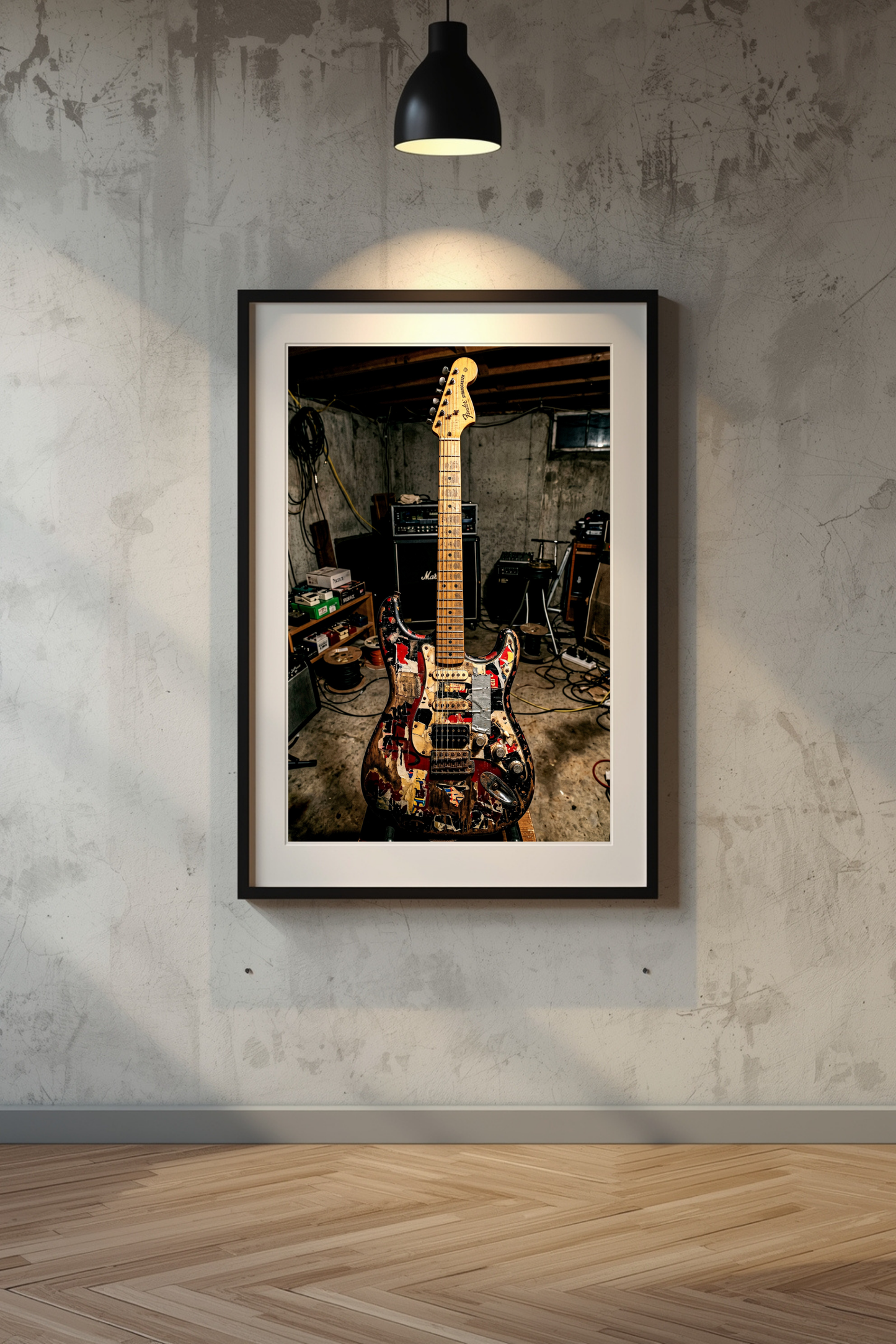 Framed photograph of a guitar in a room with musical equipment on a textured wall.