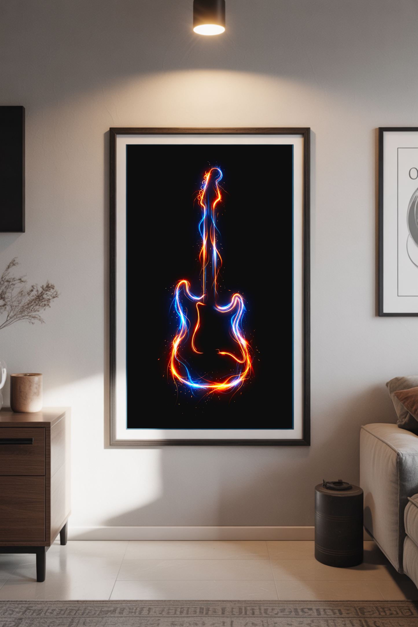 Framed artwork of a guitar with a blue and orange light effect on a wall in a living room.