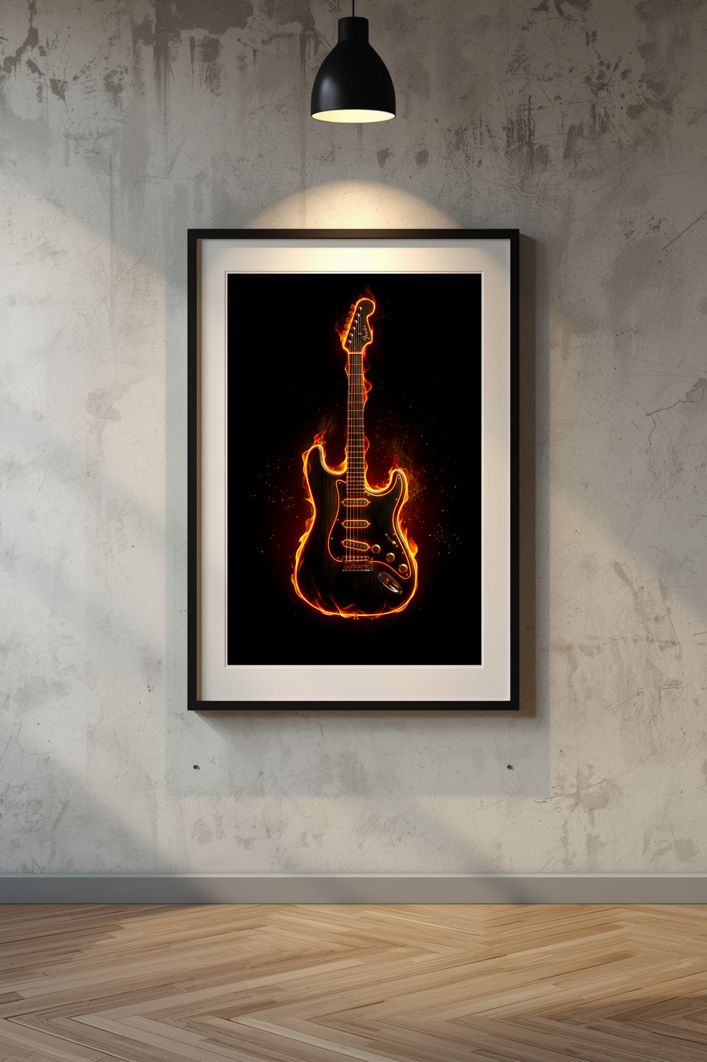 Framed artwork of a guitar in flames on a textured wall with a lamp above.