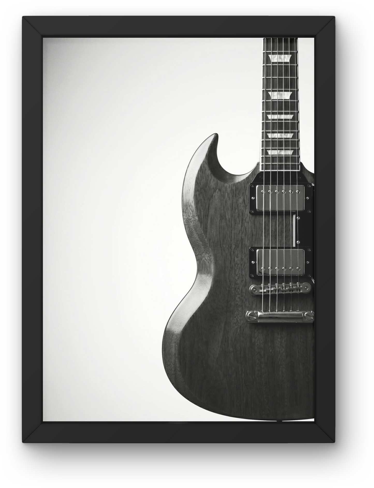 Framed black and white photograph of a gibson SG guitar on a white background