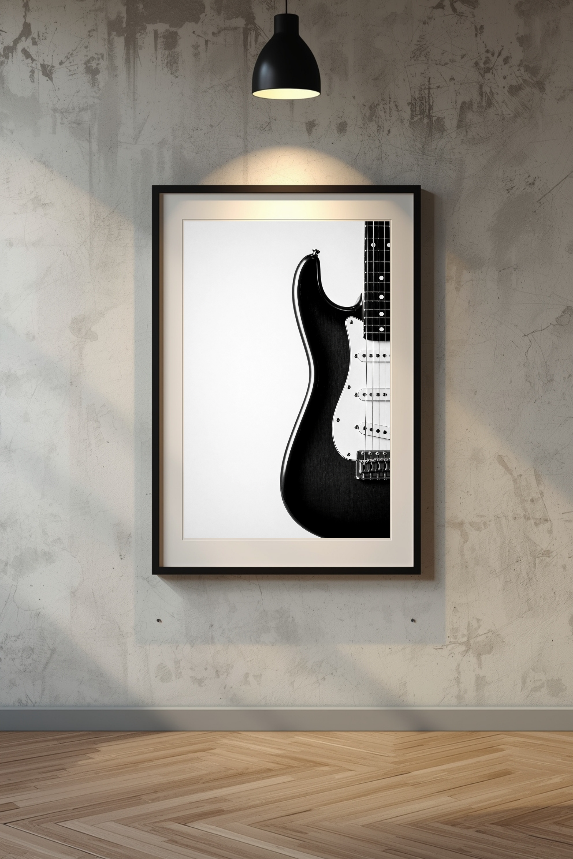 Framed black and white Stratocaster guitar art print on a textured wall.