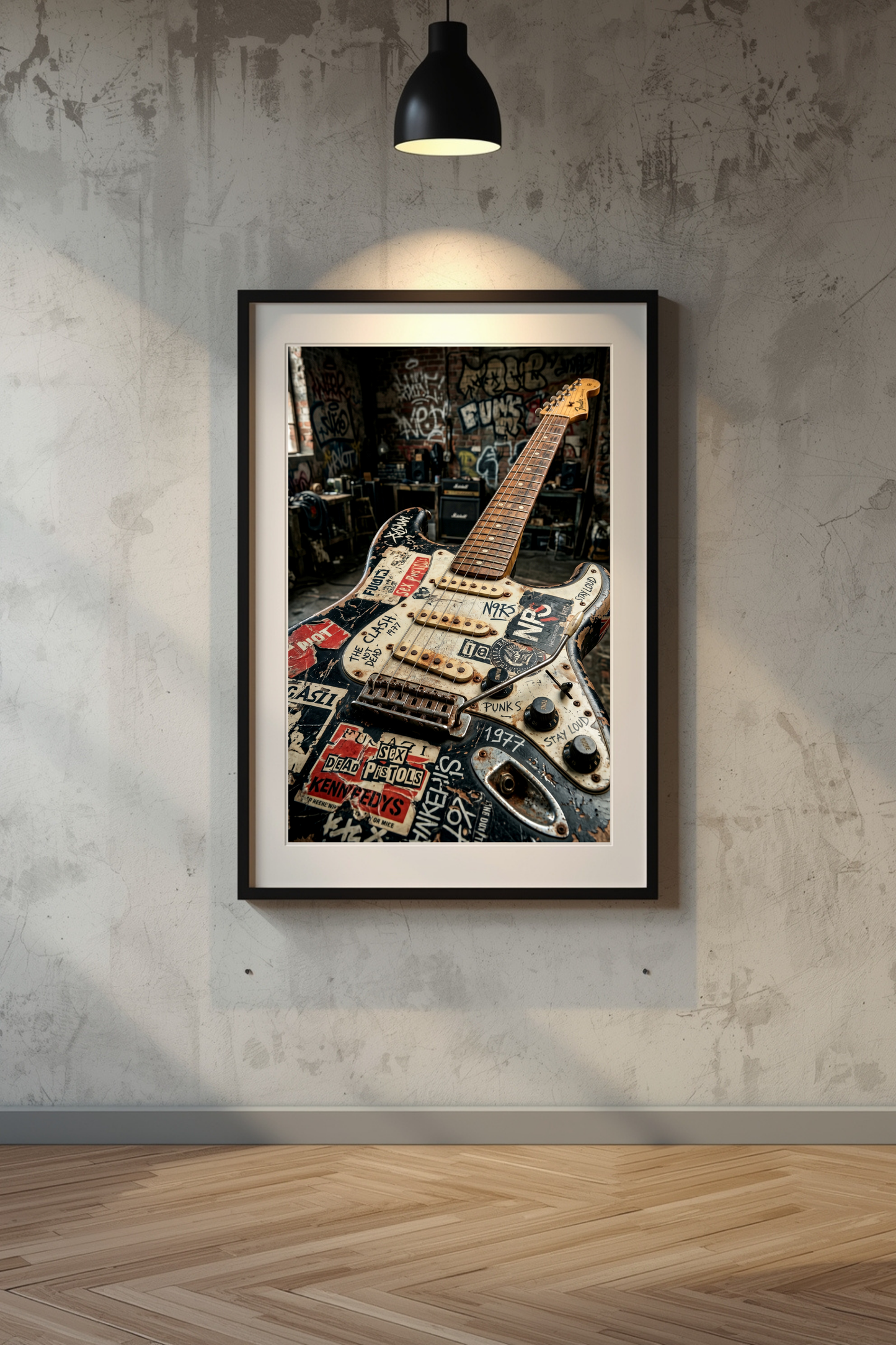 Framed picture of a decorated electric guitar on a textured wall.