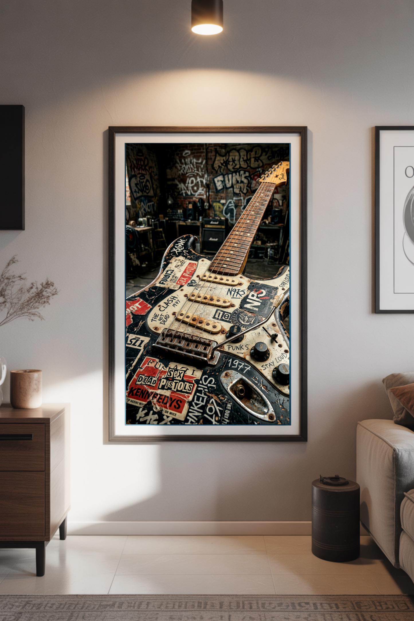 Framed artwork of a guitar on a wall in a living room setting