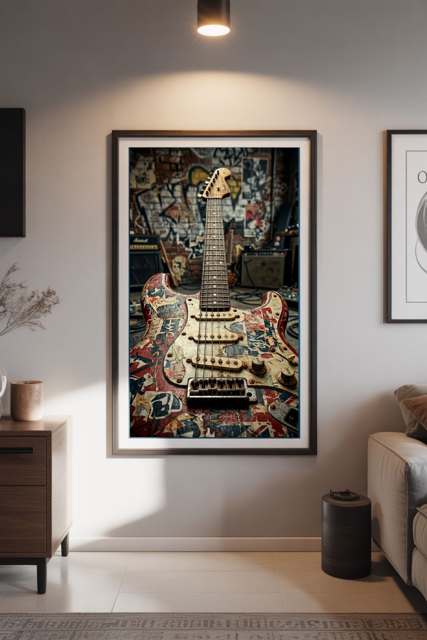 Framed artwork of a guitar with colorful relic'd design on a wall in a living room.