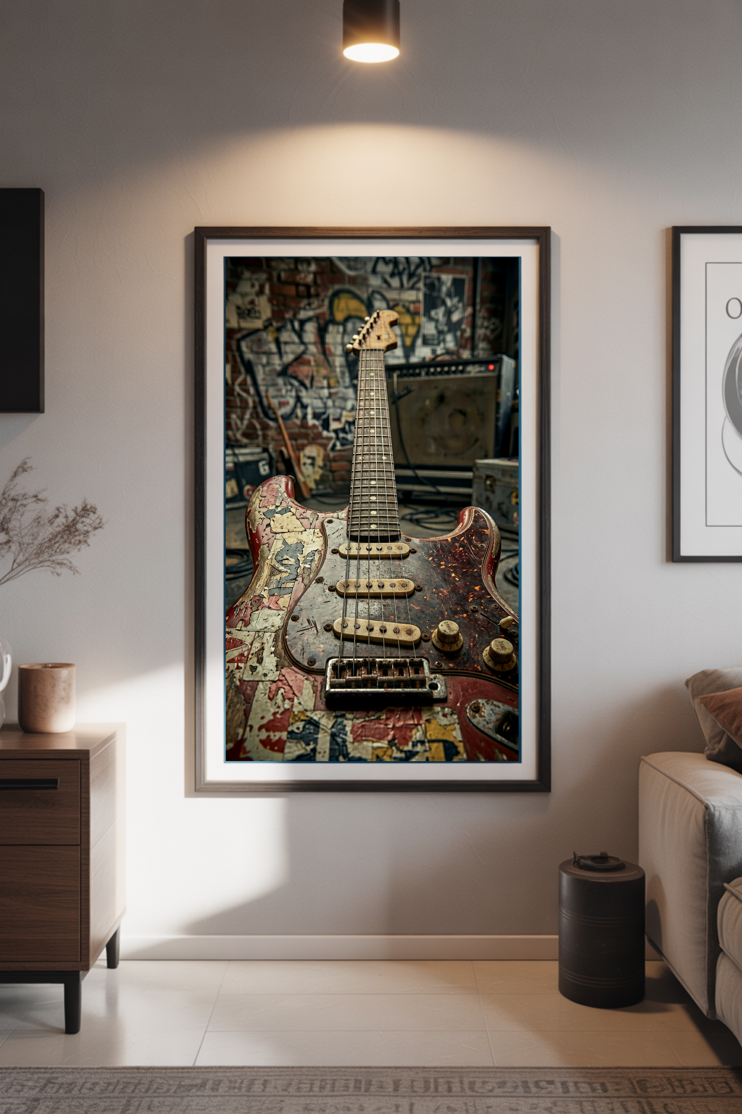 Framed artwork of a worn guitar on a wall in a living room setting.
