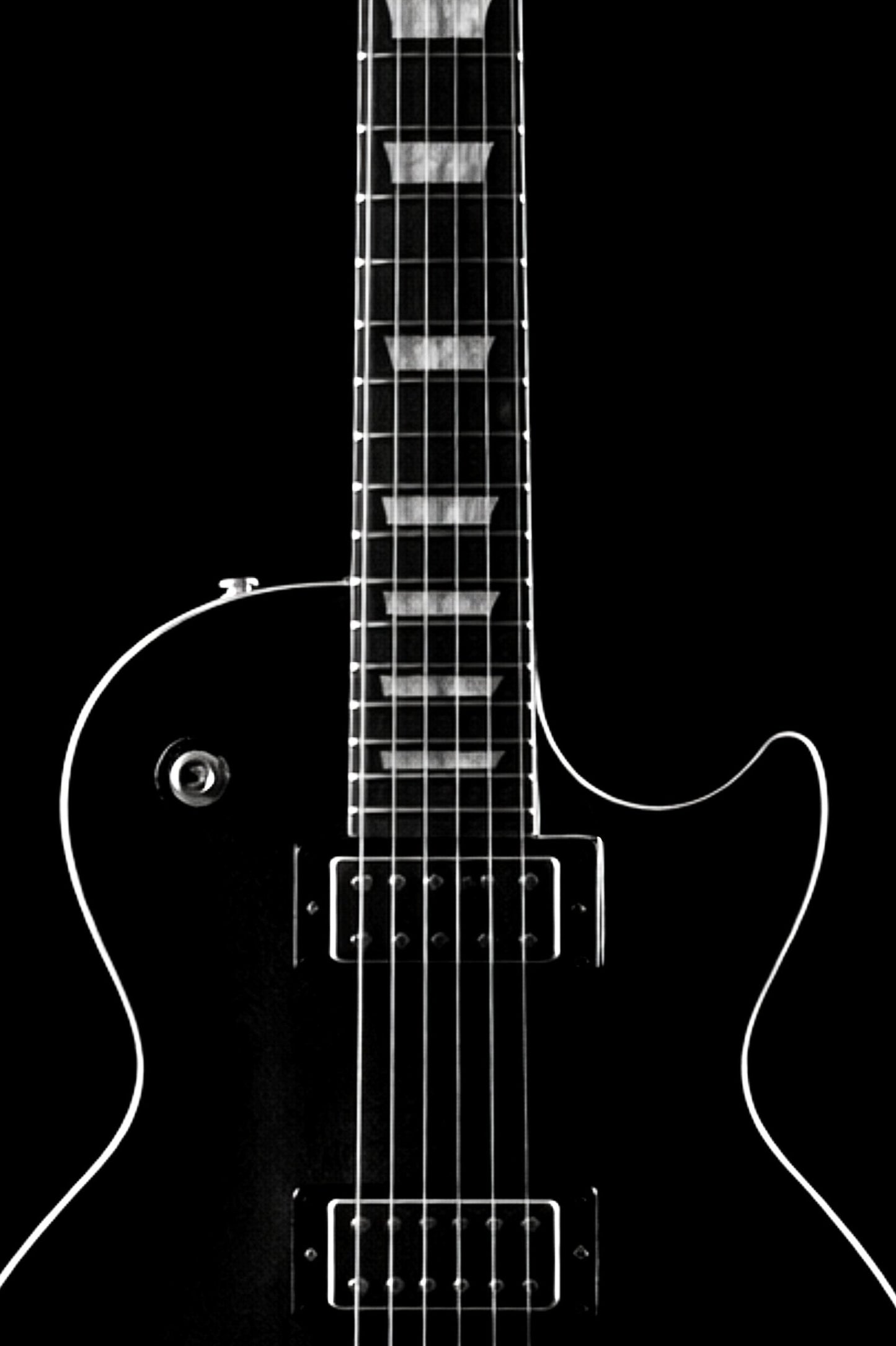 Black and white image of a guitar with a clear outline on a black background
