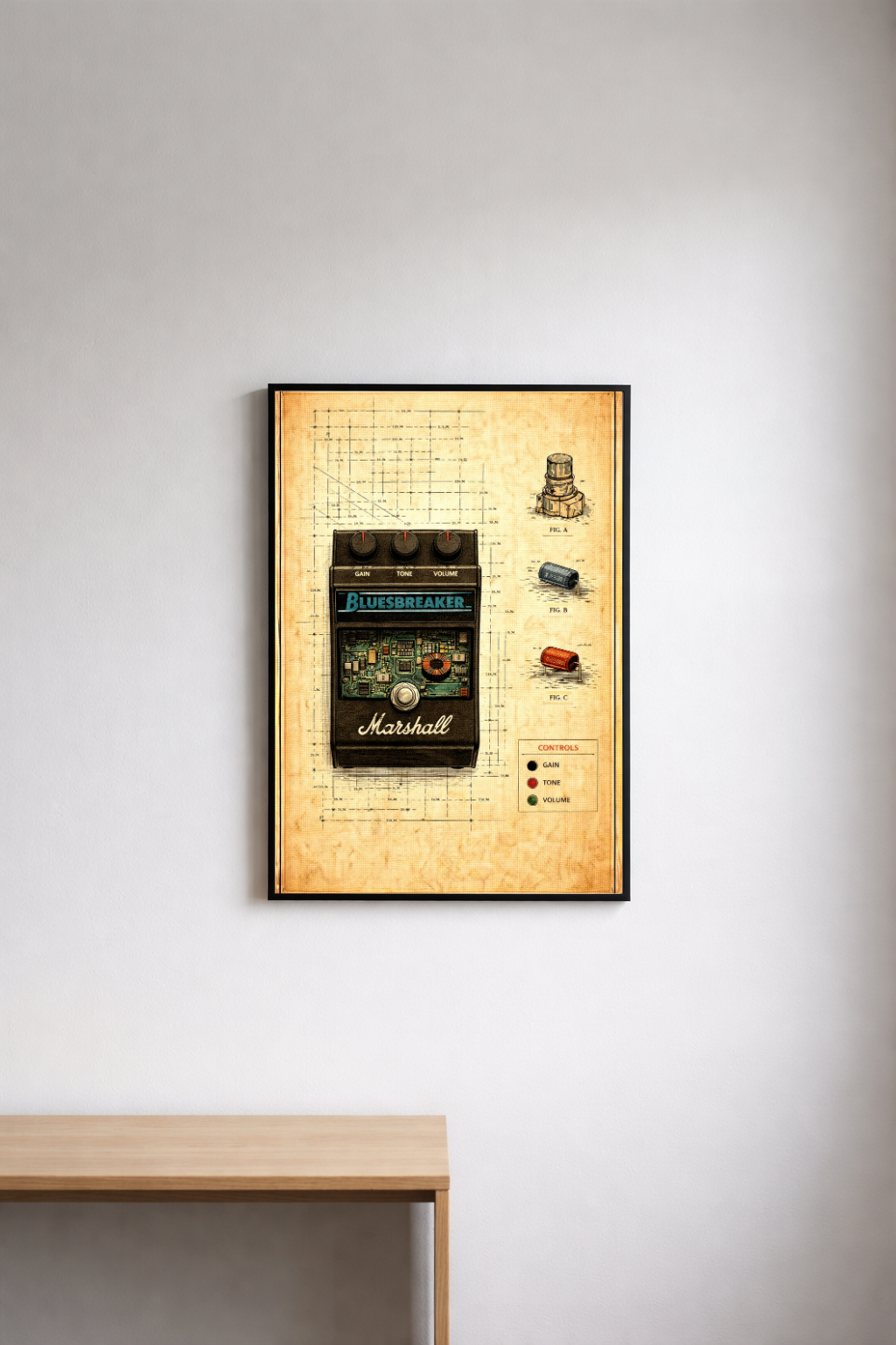Framed poster of a Marshall Bluesbreaker pedal on a wall above a wooden desk.