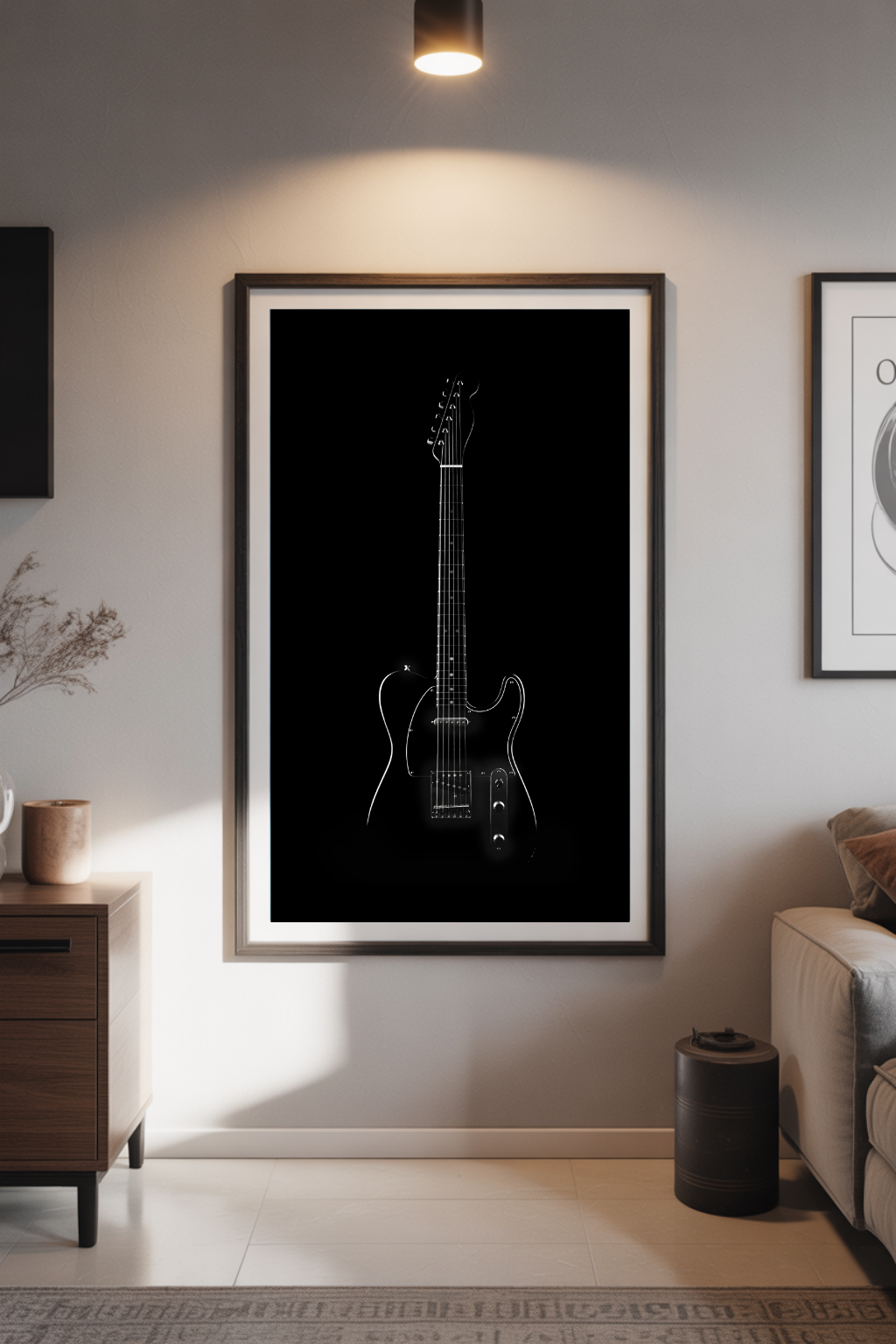 Framed black and white guitar art print on a wall in a living room.