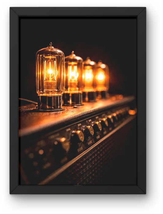 Framed photograph of glowing tube amp bulbs on an amplifier